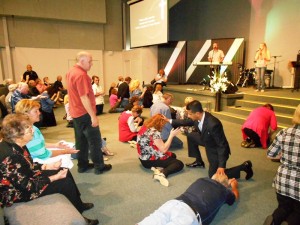 People repenting at altar