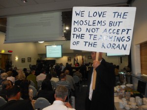 One of the many placards against proposed mosque